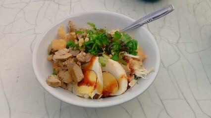 chicken porridge the traditional streetfood in Indonesia