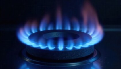 Blue gas flame burning intensely on a dark background, gas, flickering, bright