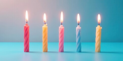 Five unlit birthday candles arranged on a smooth blue surface , anniversary, elegant