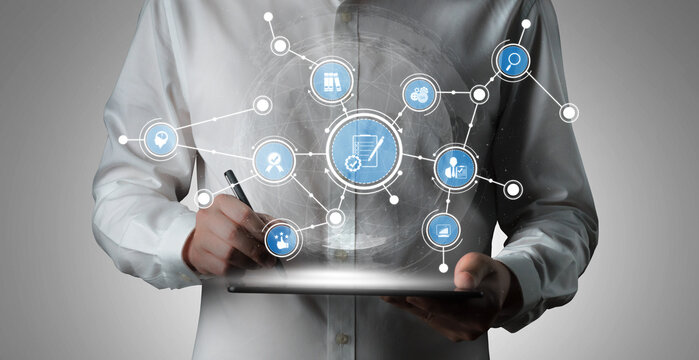 A modern businessperson engages with a digital tablet showcasing e-commerce concepts. Visualize innovative technology in a professional workplace for marketing solutions. Tessel - Powered by Adobe