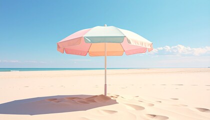 Beach umbrella on a sandy beach under a clear blue sky
