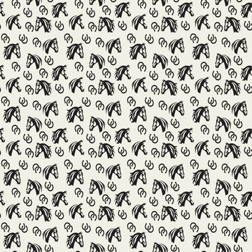 seamless pattern with black horse heads and small rough horseshoes repeated on cream background motif is high contrast rustic and conveys a sketchy folk art equestrian aesthetic vector illustration