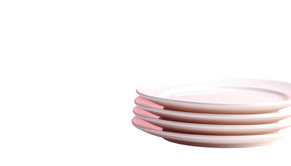 Stack of five pale pink ceramic plates against a stark black backdrop, minimal style
