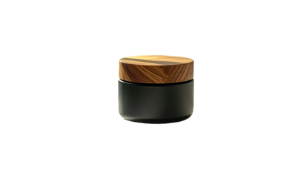 Matte black jar with a textured wooden lid, center lit, isolated against a stark black background