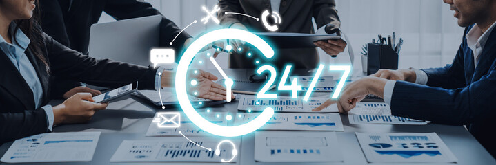 A modern business team engaged in a collaborative meeting, supported by digital tools and 247 availability. Financial charts and data guide their productive discussions. Trope