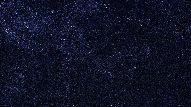 an abstract, distressed black texture featuring white speckles and grain, commonly used as a digital overlay or background element. 