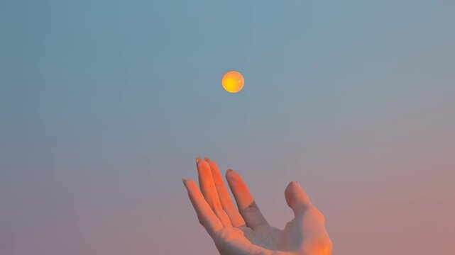 hand holding tiny glowing sun, pastel background, surreal minimal stock photo style