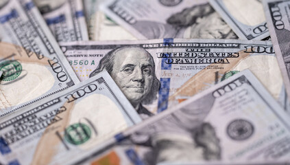 Money background with 100-dollar bills. Texture of US currency. 100 USD banknotes background. American hundred-dollar notes background. Pattern of US dollars for finance concept. Cash background.