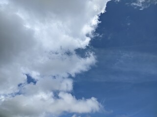 Dramatic Blue Sky Contrast with White and Gray Storm Clouds