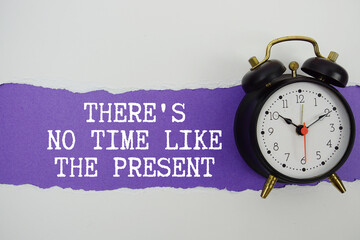 There's No Time Like The Present text on purple with white paper torn ripped of horizontal and alarm clock