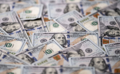 Money background with 100-dollar bills. Texture of US money currency. 100 USD banknotes in focus. American hundred-dollar money for banner. Pattern of US dollars. Money for finance concept.