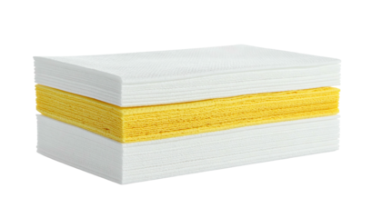 Stack of white and yellow paper napkins with a textured surface, isolated against a black background