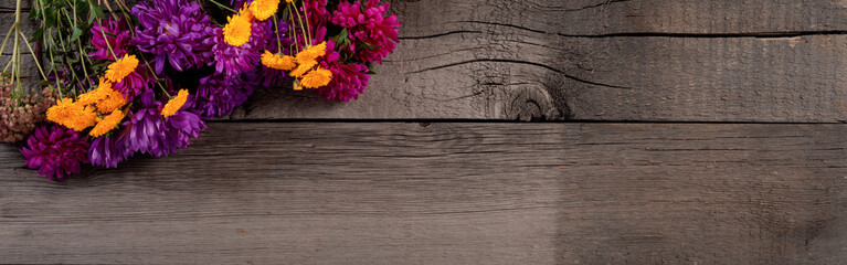 Colorful Floral Composition on Rustic Wooden Background with Copy Space