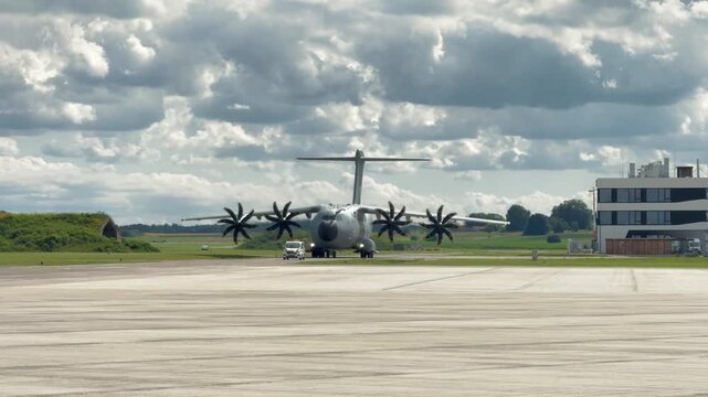 German Air Force A400M plane behind follow-me at Oberpfaffenhofen airport, Bavaria