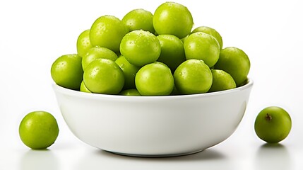 A bowl full of fresh green plums with water droplets and two plums on the surface