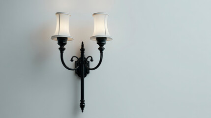 A wall with a black and white lamp that has two white shades