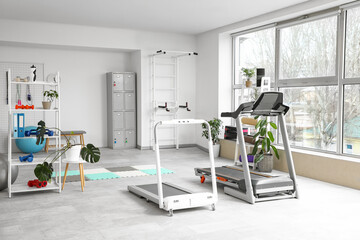 Fototapeta premium Treadmills in interior of light gym