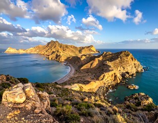 Aerial view of mountainous coastline with turquoise water under a blue sky