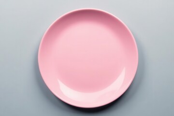 Close-up of empty pink plate on gray surface Minimalist, clean aesthetic , studio, simple