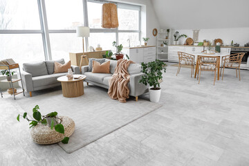 Interior of stylish studio apartment with living room and kitchen