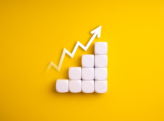 Minimal white cube blocks forming ascending bar chart with upward arrow isolated on yellow background. Concept of business growth, success progress, performance metrics, and step-by-step development.