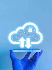 Cloud storage and data security concept with upload and download icons above smartphone holding by...