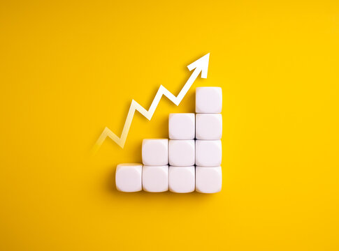 Minimal white cube blocks forming ascending bar chart with upward arrow isolated on yellow background. Concept of business growth, success progress, performance metrics, and step-by-step development.