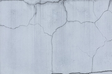 Gray concrete surface with cracks. Construction and renovation. Background. Space for text.