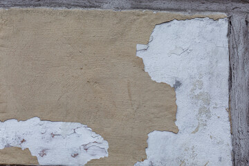 An old beige peeling concrete wall. Construction and renovation. Background. Space for text.