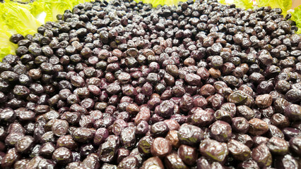 Fresh olives displayed at a local market in daytime