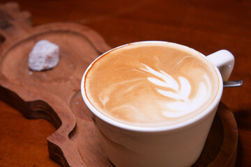 Latte art in a cozy cafe setting captures warm moments