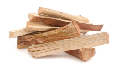 A stack of split firewood on a white background