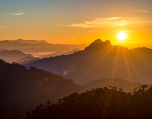A scenic mountainous landscape silhouetted against a radiant sunrise, with golden rays bursting over peaks and valleys