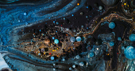 Paint liquid. Oil texture. Blur blue orange color dark black purple bubble glitter round acrylic flow splash floating on abstract art background.