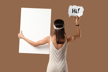 Young woman holding speech bubble with word HI and blank poster on beige background