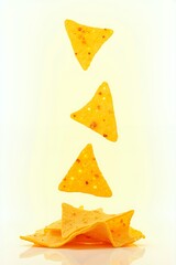 Golden tortilla chips in midair a delicious snack.