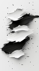 Dynamic black and white paint strokes create an abstract composition with scattered splatters on a clean white surface.
