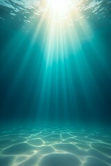 Underwater scene with sun rays illuminating the clear blue ocean water and sandy seabed.