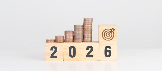 Happy New Year 2026 with Coins stack and dartboard icon. Strategy, goal, Money, Budget, tax, investment, financial, savings and New Year Resolution concepts