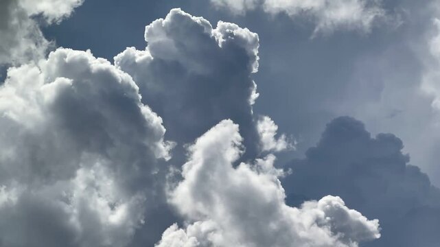 Time-Lapse of Moving Clouds in a Clear Sky. Perfect for creating tension or signaling an approaching weather shift.
