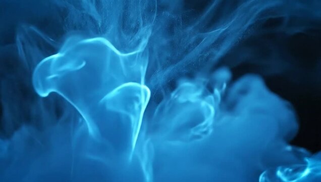 Blue smoke explosion on black background.