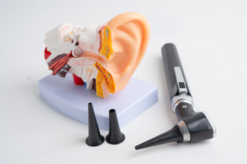 Otoscope isolated on white background for otolaryngologist or ENT physician doctor examining senior patient ear, hearing loss problem.