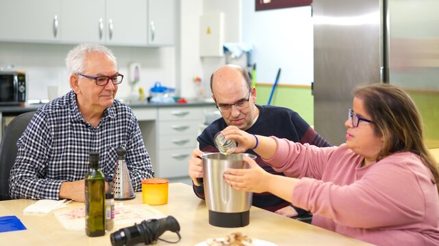 People cooking together in an inclusive kitchen community