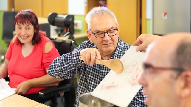 People with physical disability cooking together in a kitchen