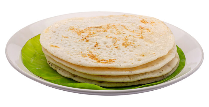 Traditional South Indian appam served warm on white plate