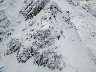 Snowy Mountain Ridge With Jagged Rocks And Snow In British Columbia, Canada