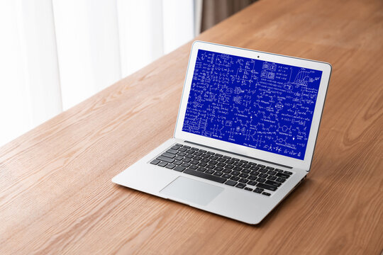 Mathematic equations and modish formula on computer screen showing concept of science and education