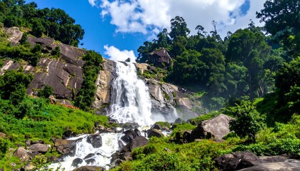 Majestic waterfall cascading through lush greenery in Horton Plains, Sri Lanka.