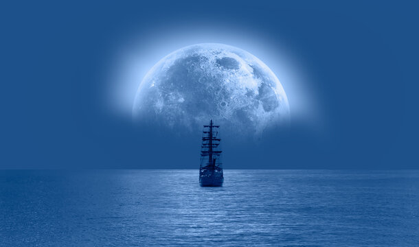 Sailing old ship in calm sea - Night sky with moon in the clouds "Elements of this image furnished by NASA