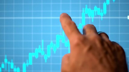 Close up shot of financial chart analysis with index finger pointing at the stock market trend in turquoise blue background and blurred hand. - Powered by Adobe